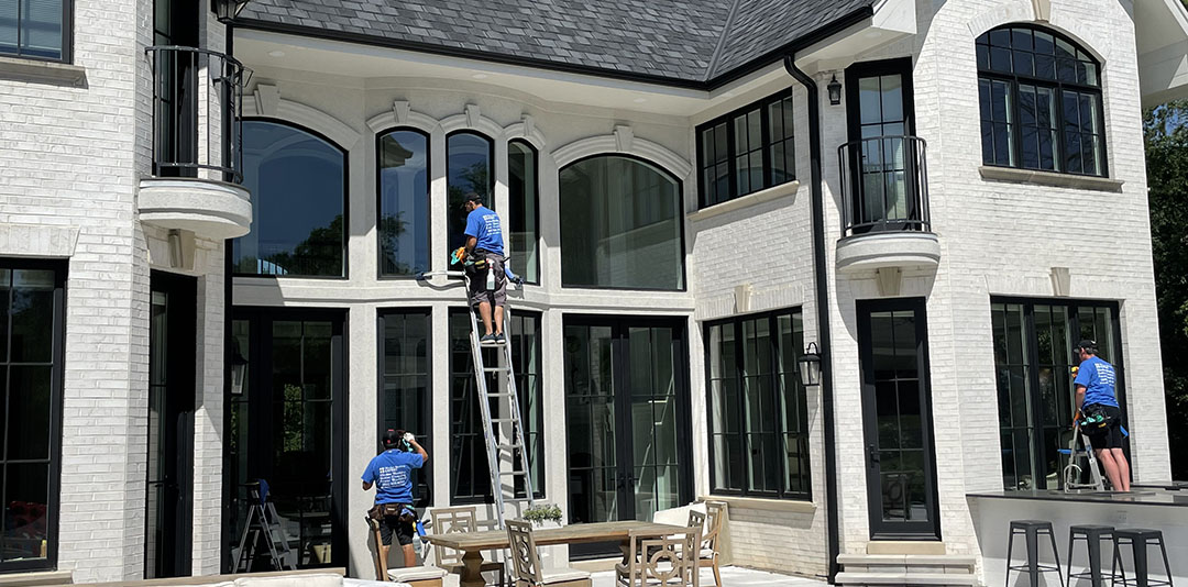 window washers working at the house